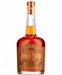 A bottle of Joseph Magnus Cigar Blend Bourbon rum with amber liquid, a brown label, and a cork stopper, shown on a plain white background.