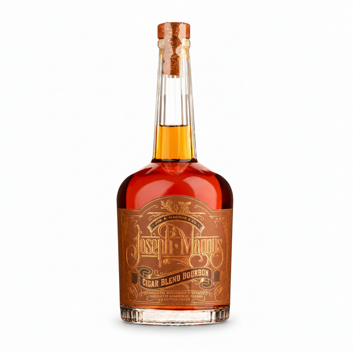A bottle of Joseph Magnus Cigar Blend Bourbon rum with amber liquid, a brown label, and a cork stopper, shown on a plain white background.
