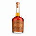 A bottle of Joseph Magnus Cigar Blend Bourbon rum with amber liquid, a brown label, and a cork stopper, shown on a plain white background.