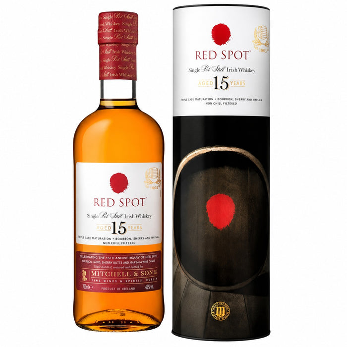 A bottle of Red Spot 15 Year Old Single Malt Irish Whiskey next to its black and white branded presentation box, shown on a plain white background.