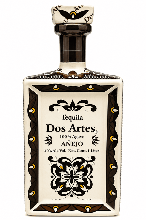 Tequila Dos Artes Anejo bottle with decorative label on a white background