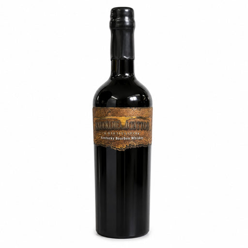 A bottle of Kentucky Bourbon Whiskey with a black glass body, black cap, and a brown label featuring a castle illustration and the text 'MONTES VALLIS Kentucky Bourbon Whiskey on the white back ground
