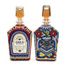 Two colorful bottles with intricate designs and 'Chula Parranda' branding on a white background.