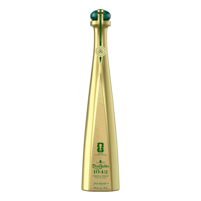 Gold tequila bottle with green cap on a white background