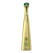 Gold tequila bottle with green cap on a white background