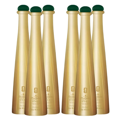 Set of six gold bottles with green caps on a white background