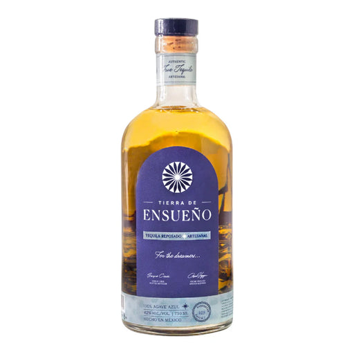 Bottle of Tierra de Ensueno liquor with a purple label on a white background